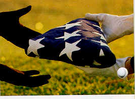 a folded American flag being passed