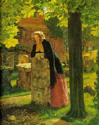 a woman leaning on a tombstone