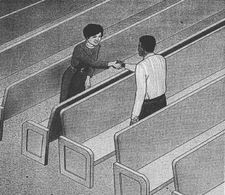 People standing in pews and shaking hands
